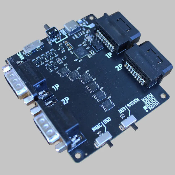 Black electronic circuit board with multiple ports including usb, db9, and two labeled 1p/2p connectors.